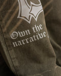 OTN Own The Narrative army green denim trousers with white cross design